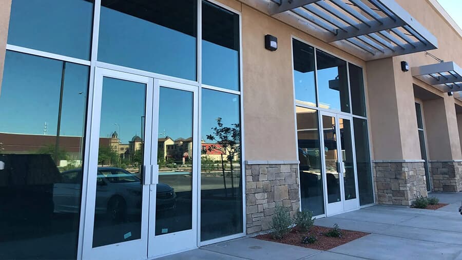Modern glass storefront entry door with aluminum frame