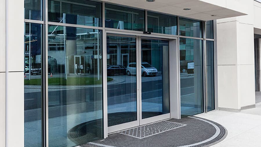 Retail store automatic sliding entry door