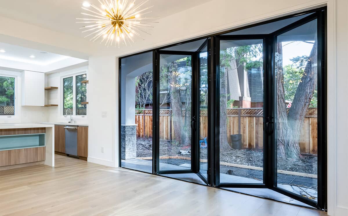 Wide Span Commercial Folding Glass Door System Fully Opened in Event Hall Wide Span Commercial Folding Glass Door System Fully Opened in Event Hall
