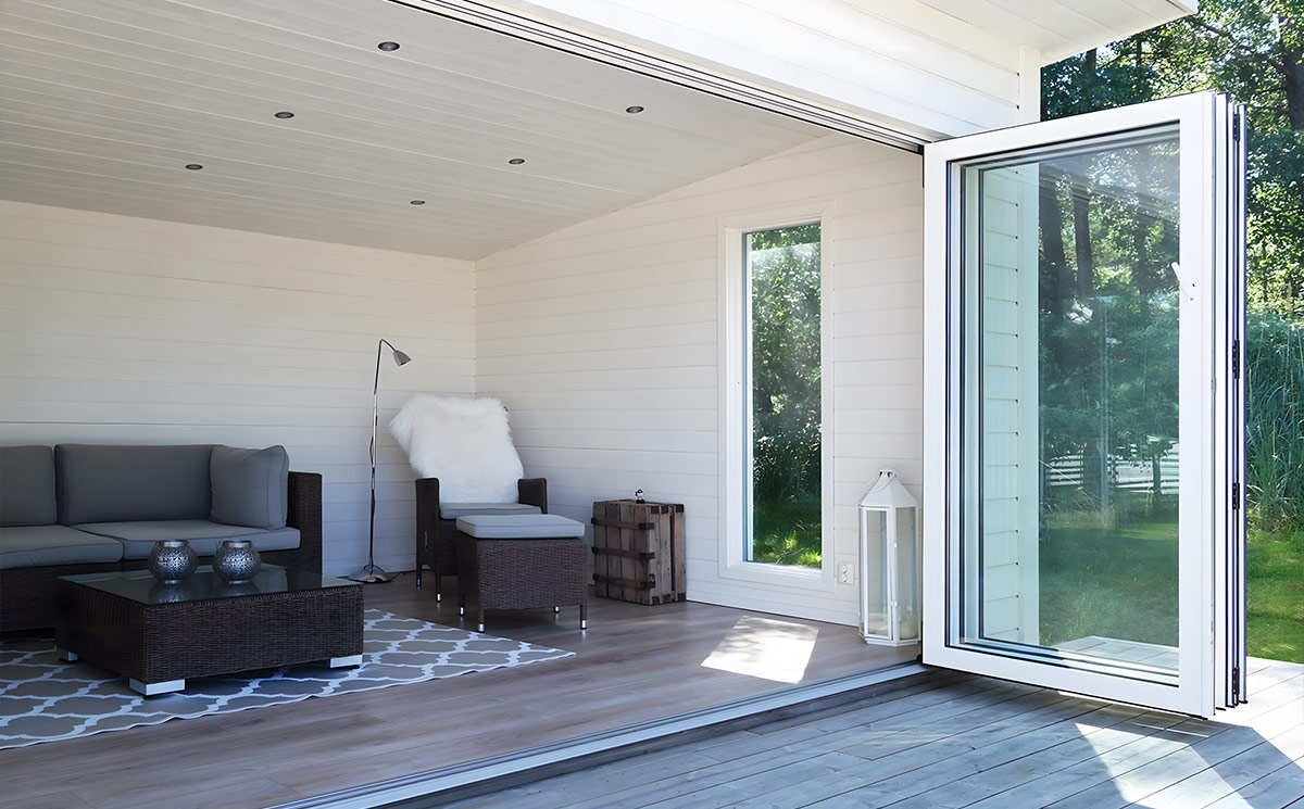 Luxury Villa Living Room with Corner Folding Glass Doors Facing Outdoor Greenery