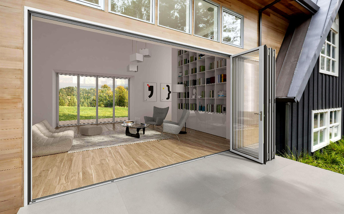 A modern villa featuring an ultra-slim aluminum folding door system that opens up completely to an outdoor deck