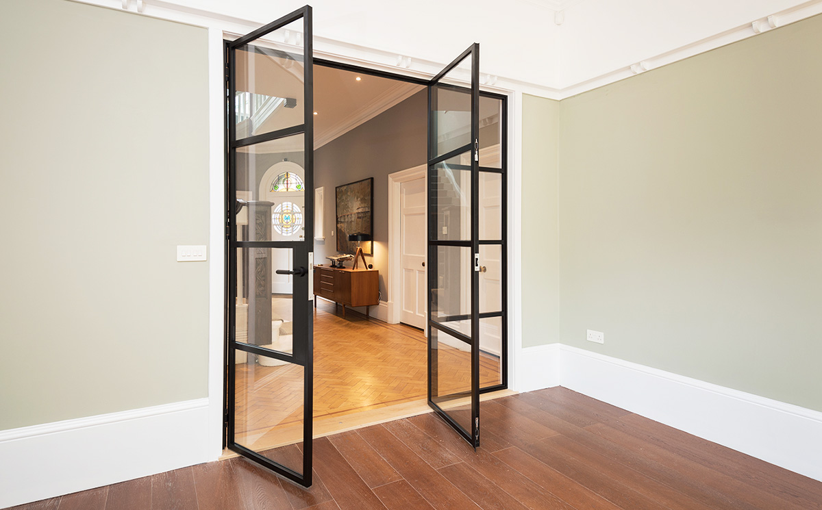 Modern black steel-look double glass doors in Crittall style for living room partition