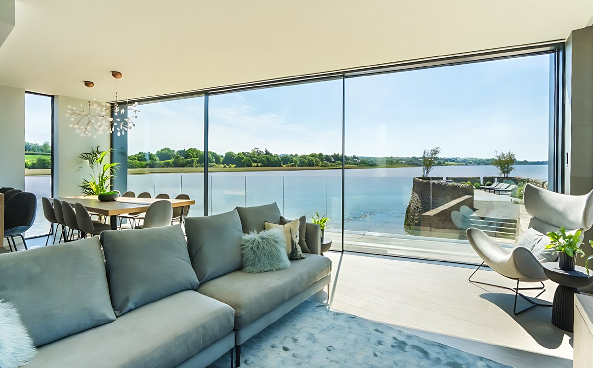Panoramic ultra slim sliding door system in luxury waterfront villa with lake view