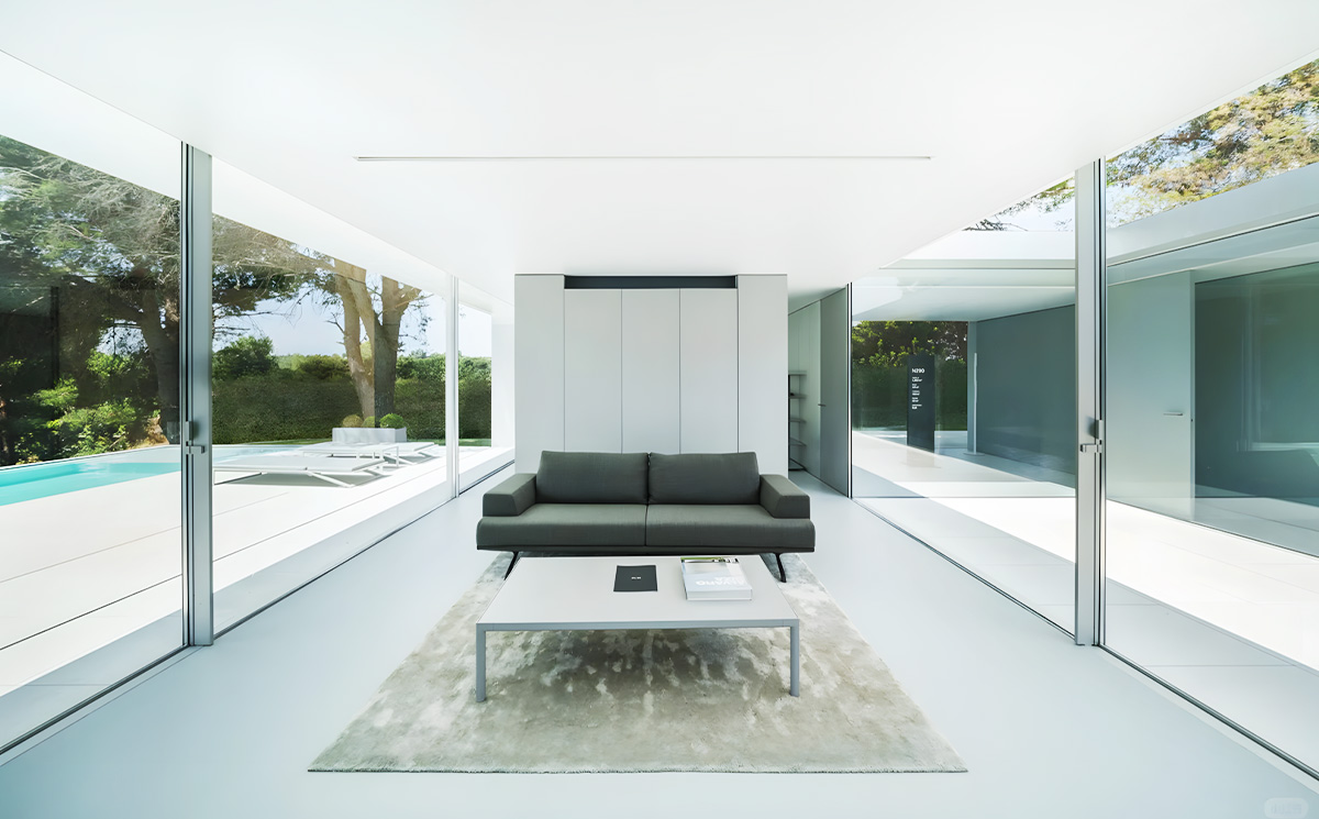 Minimal frame sliding door system installed in modern luxury home living room with open views
