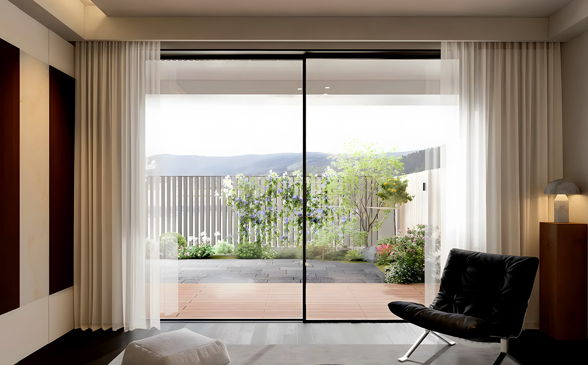 Minimal frame sliding door system installed in modern minimalist living room overlooking garden terrace